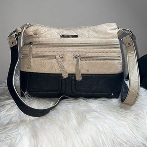 This is a light cream on top and black on the bottom stone & CO bag very stylish